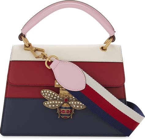 bee stripe gucci pouch|Gucci luggage.